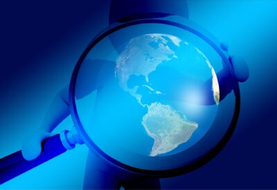 magnifying glass over the globe