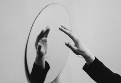 person touching mirror