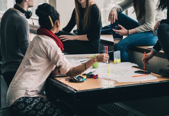 students talking at a table